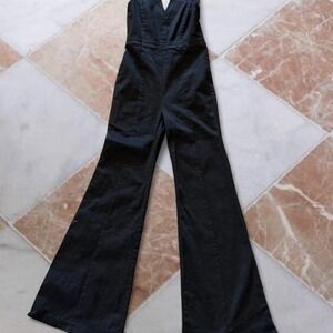 Altar'd State Black denim jumpsuit with cut out detail and wide leg flare